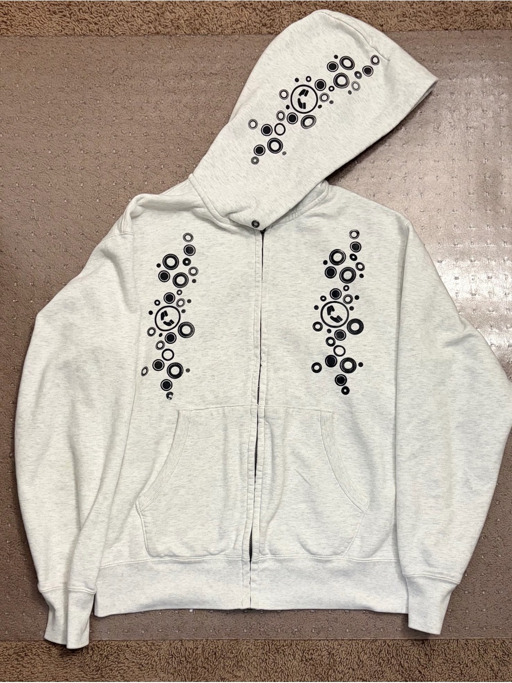 Men's Light Gray Zip-Up Hoodie with Black Graphic Accents